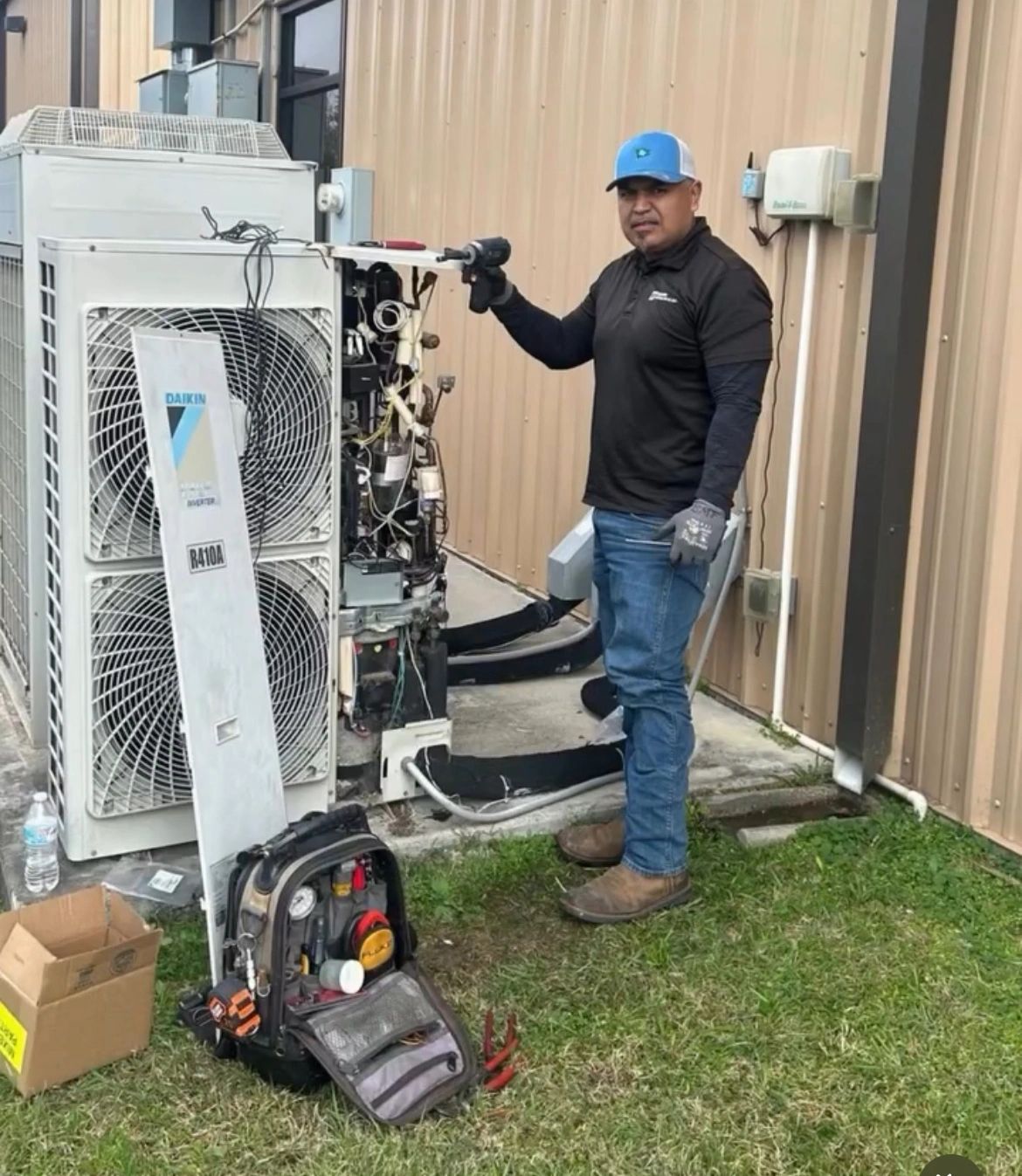 Strong Village technician installing and commissioning HVAC equipment
